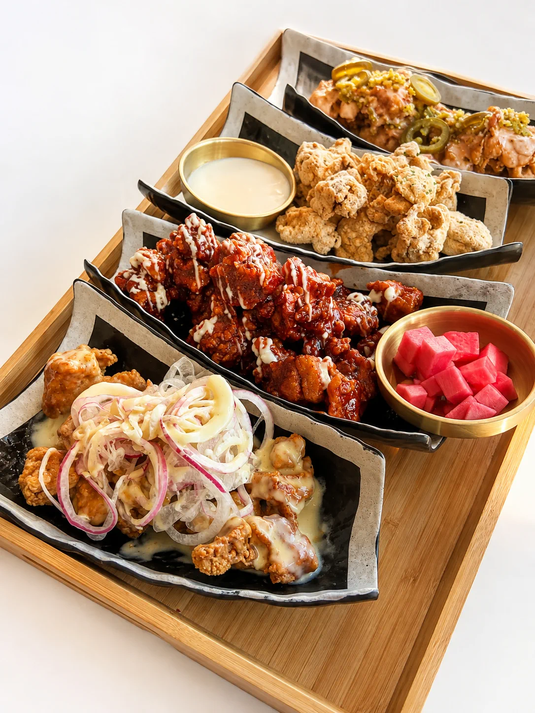 Assorted Korean fried chicken platter with pickled radish